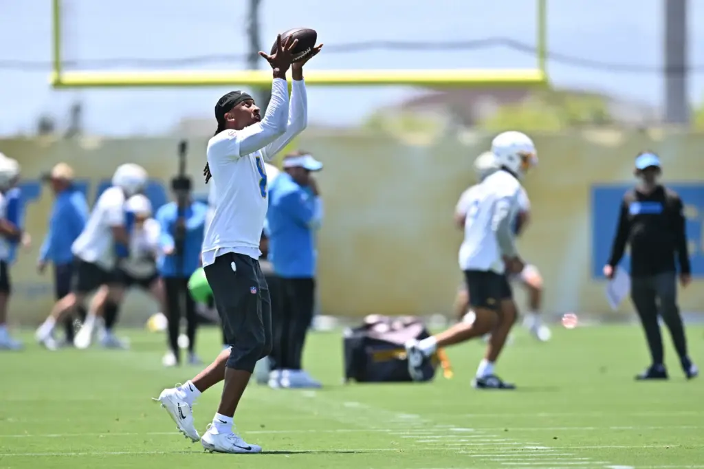 Chargers wide receiver Quentin Johnston runs a drill during the...