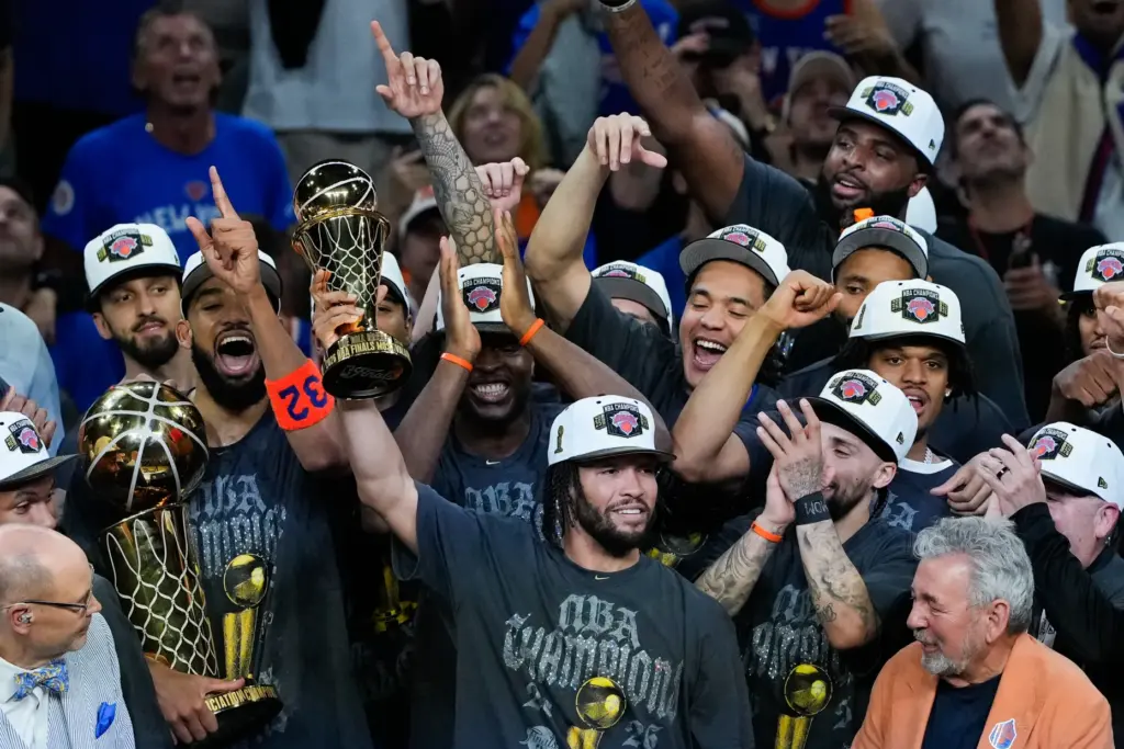 New York Knicks guard Jalen Brunson holds the MVP trophy...