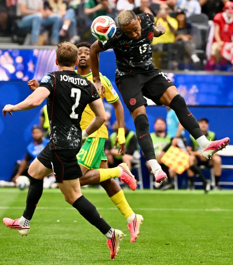 Canada defender Derek Cornelius (13) with a header towards the...