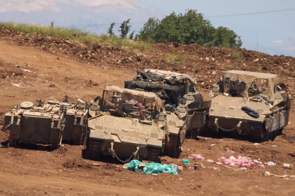 Israeli troops gather on the border with Lebanon in northern...