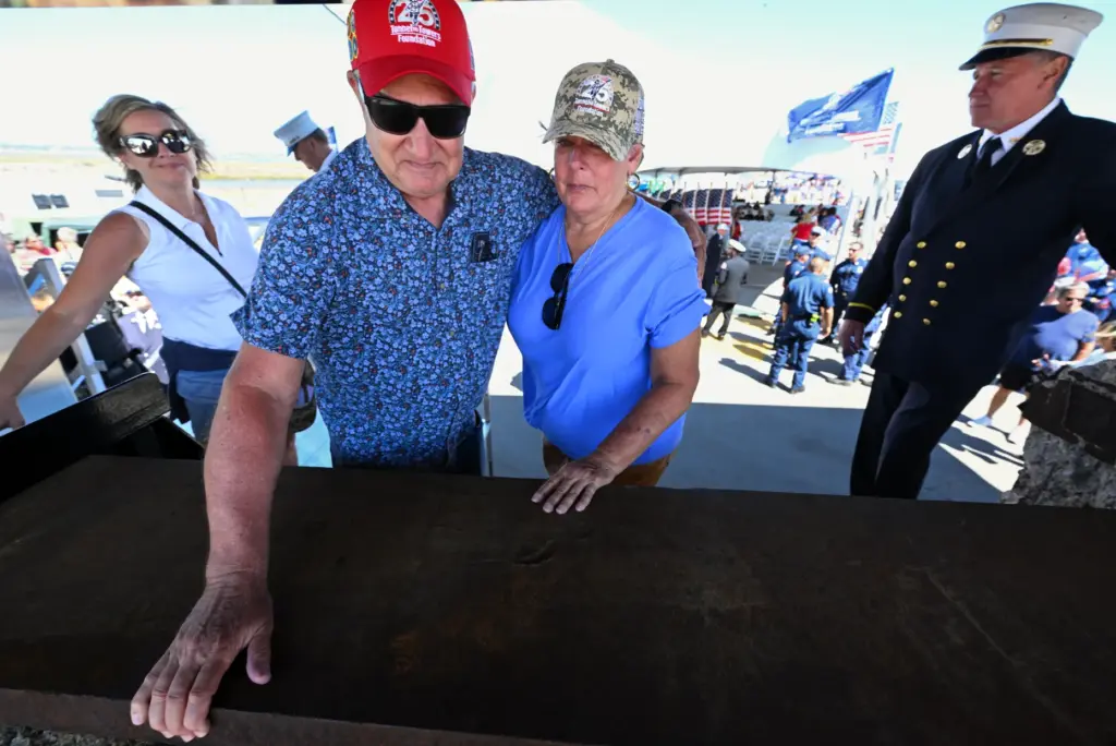 Friends Jim Edmon and Deann Day get emotional as they...