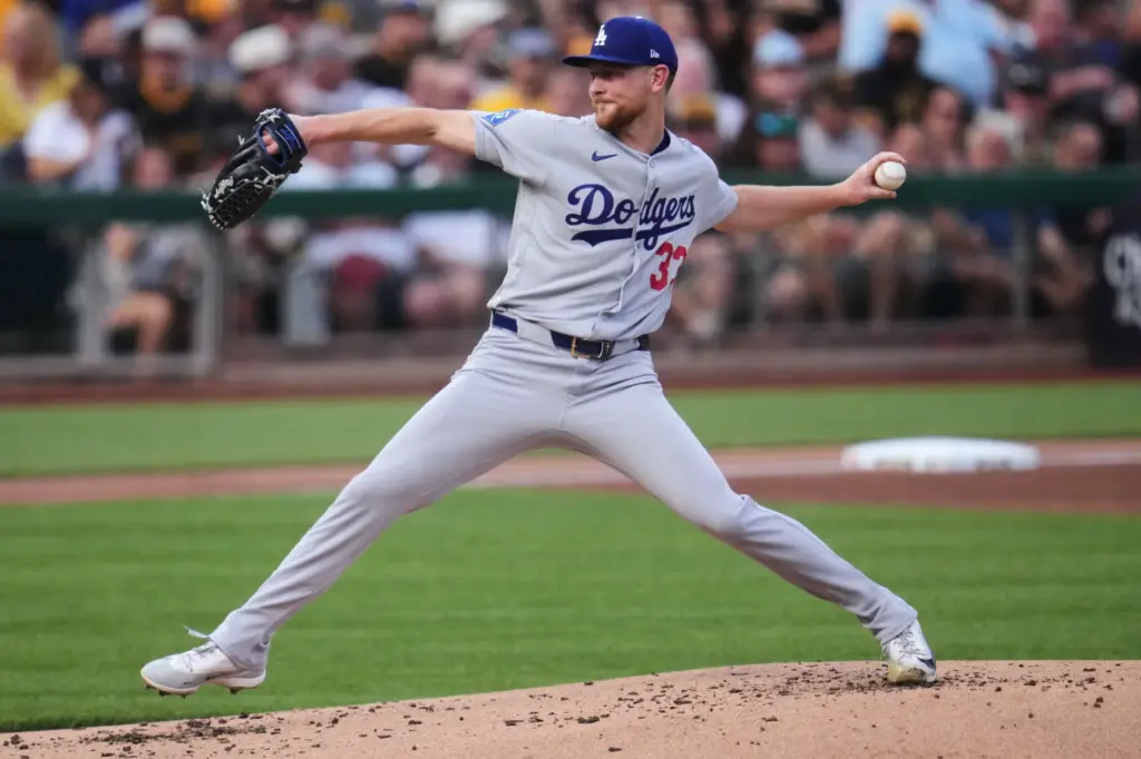 Dodgers starting pitcher Eric Lauer throws to the plate during...