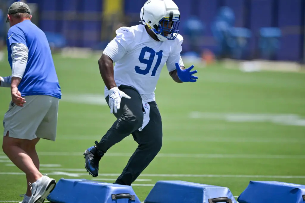 Rams defensive lineman Kobie Turner goes through drills during an...