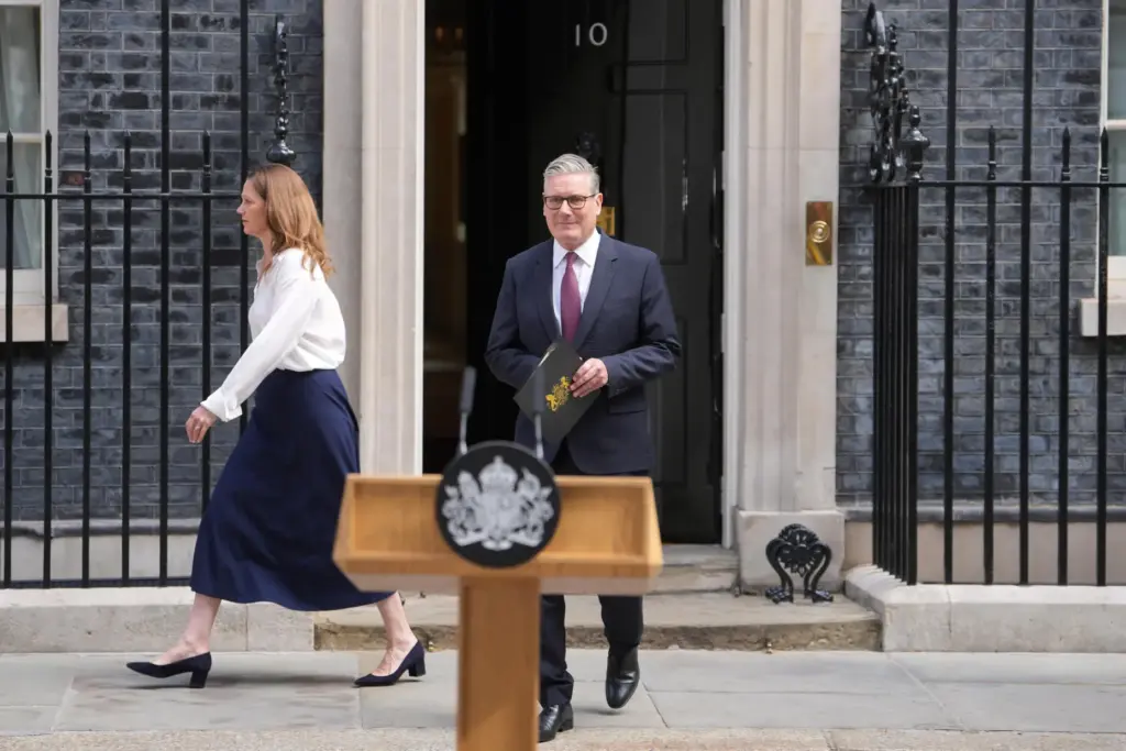 Britain's Prime Minister Keir Starmer and wife Victoria step out to announce his resignation.