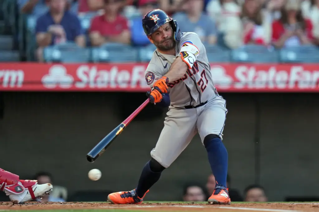 The Houston Astros’ Jose Altuve strikes out during the first...
