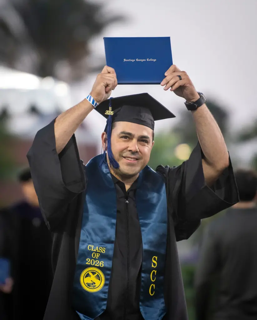 A graduate after receiving his diploma at Santiago Canyon Collegeâs...