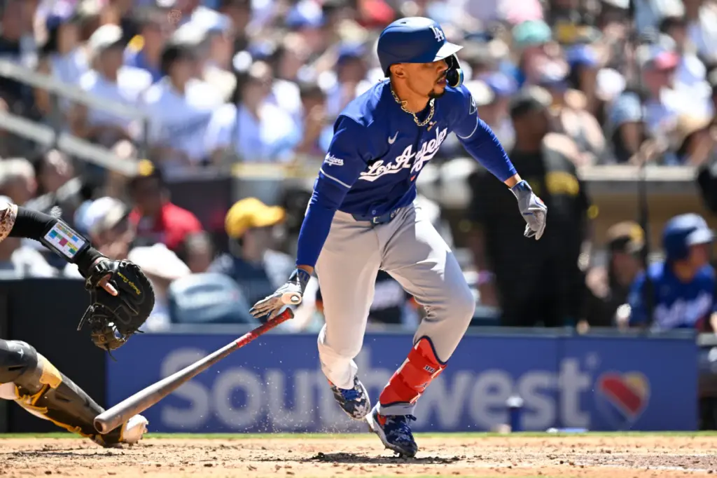 Dodgers’ Mookie Betts watches his RBI single during the fifth...