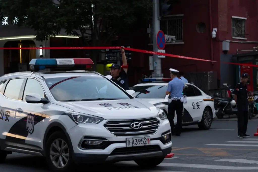 Police close off a road leading to the Citic Tower...