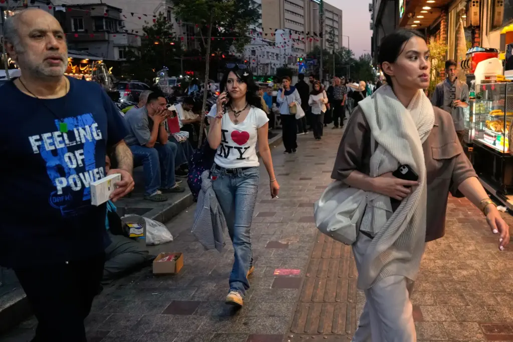 People walk along Tajrish square in northern Tehran.