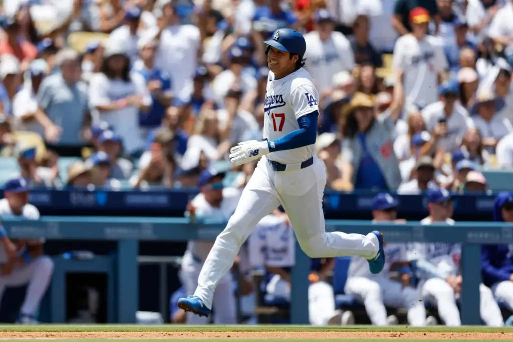Dodgers designated hitter Shohei Ohtani rounds third to home plate...