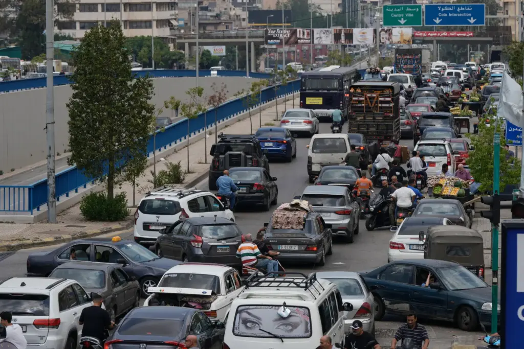 Cars sit in traffic on a highway as residents flee following an Israeli threat.