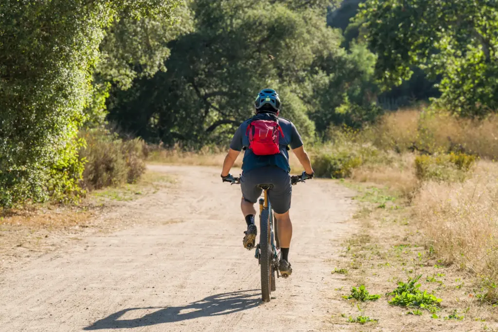 A cyclist rides on a trail in OâNeill Regional Park...
