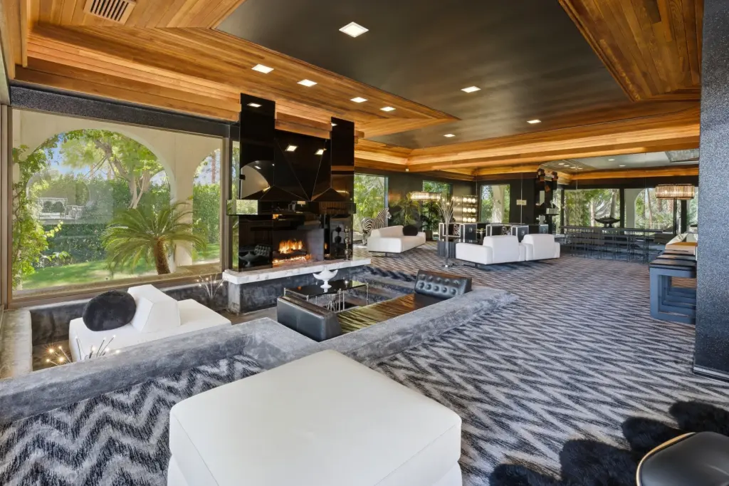 A fireplace and sunken conversation pit anchor the living room.Â (Photo...
