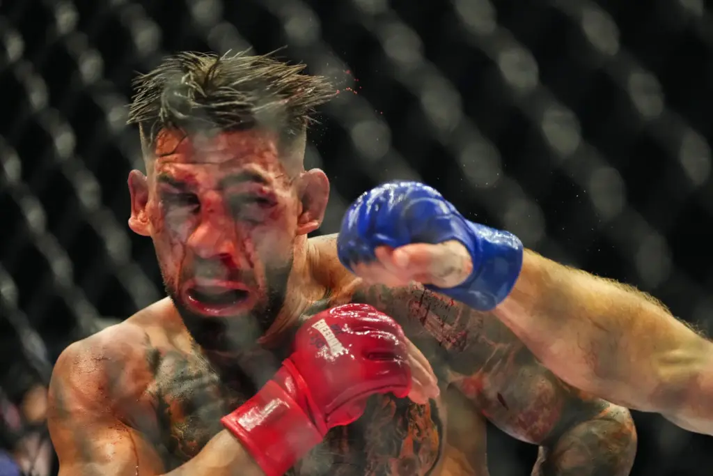 Ilia Toupruia, left, fights Justin Gaethje during UFC Freedom 250...