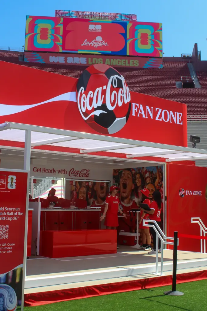 At the Coca-Cola booth, fans will be able to get...