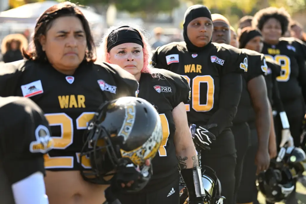 Cali War team members line up for the national anthem...