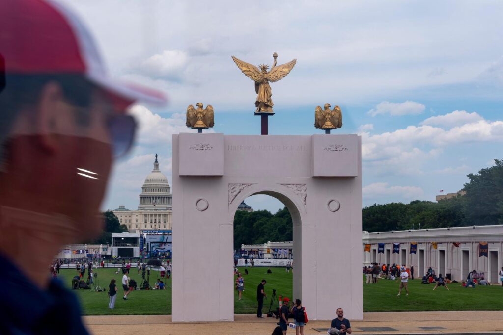 The U.S. Capitol and a mock-up of President Donald Trump’s...