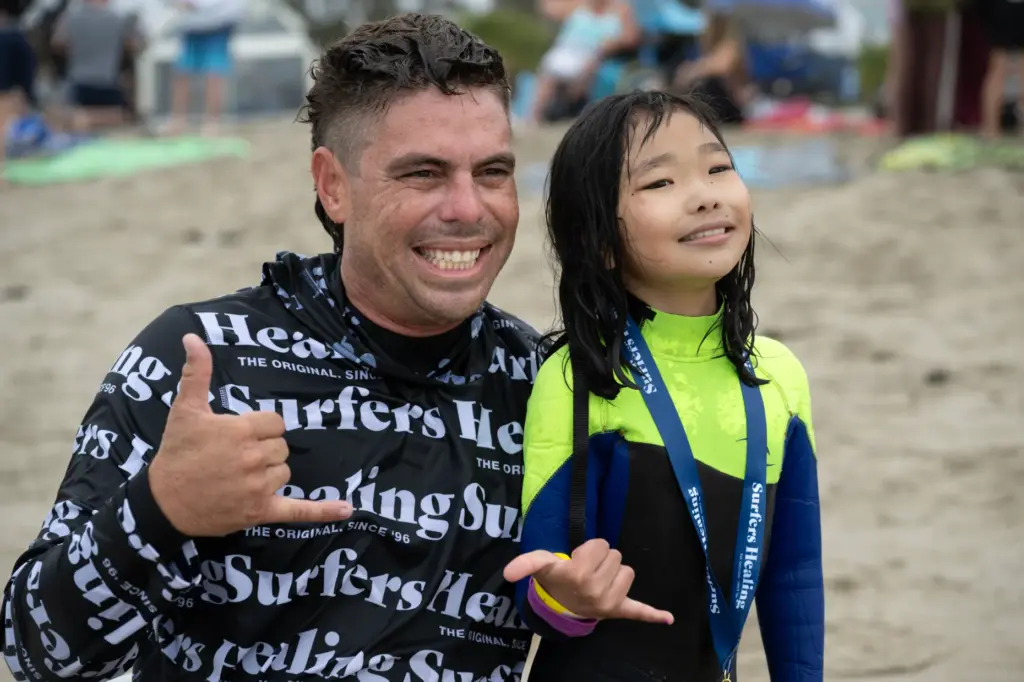 Elise Takahashi, 8, of Brea, gets her picture taken with...