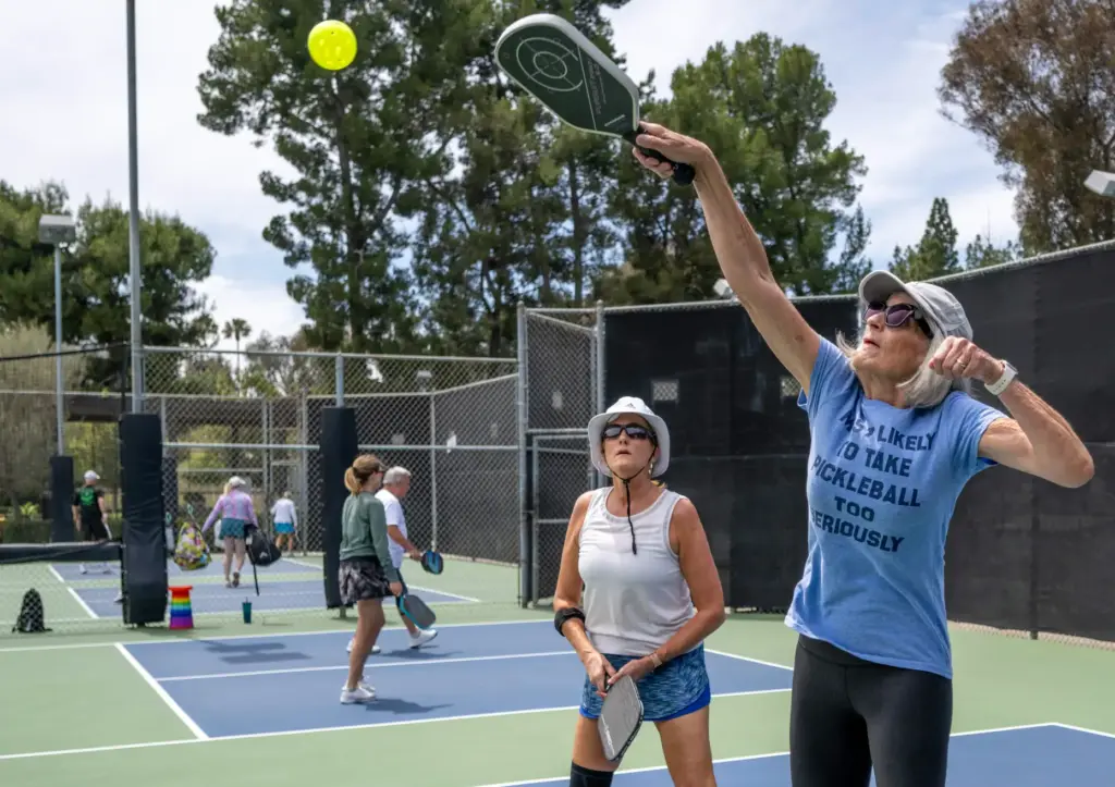 Doree Pisano of Laguna Hills hits the ball while wearing...