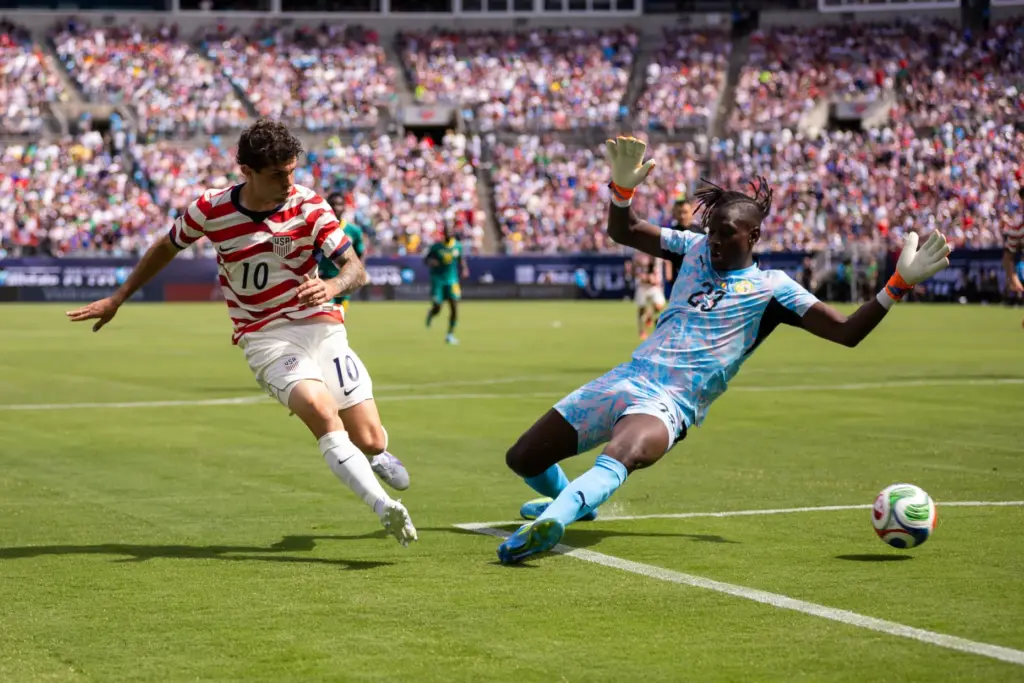 United States forward Christian Pulisic (10) shoots past Senegal forward...