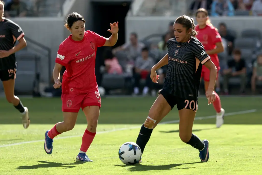 Angel City FC defender Gisele Thompson (20) controls the ball...