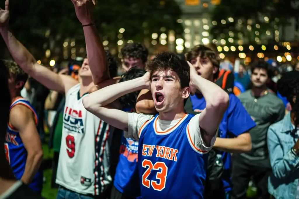A New York Knicks fan cheers at a watch party...