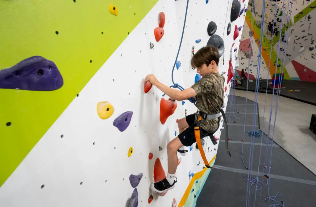 Michael Sakhnov, 11, climbs during Rock Climbing Camp at Sender...