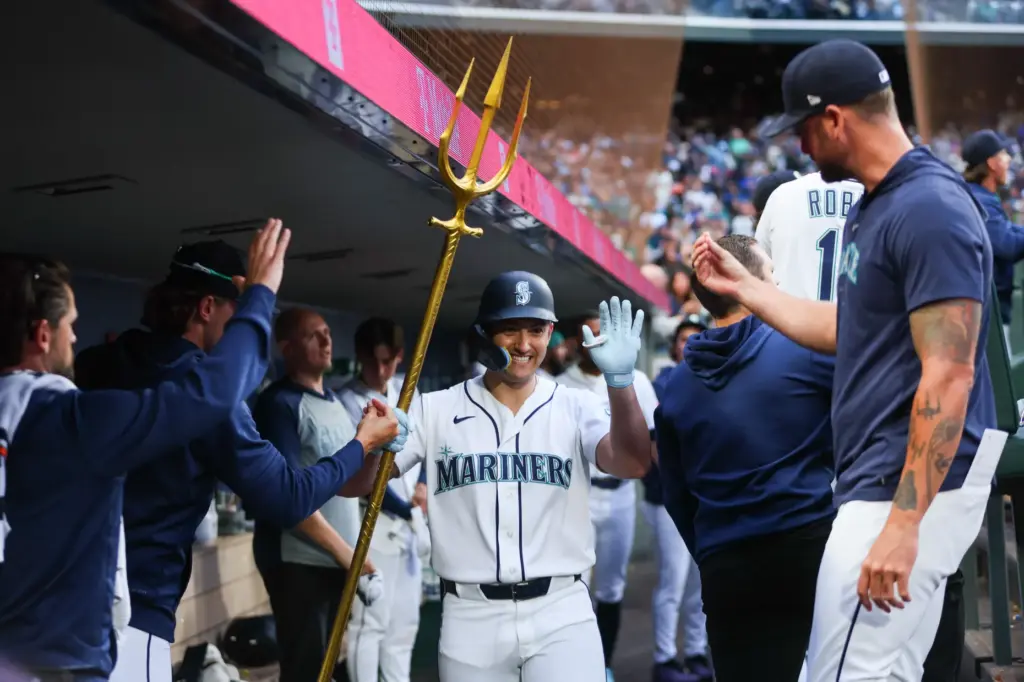 The Seattle Mariners’ Dominic Canzone celebrates after hitting a solo...