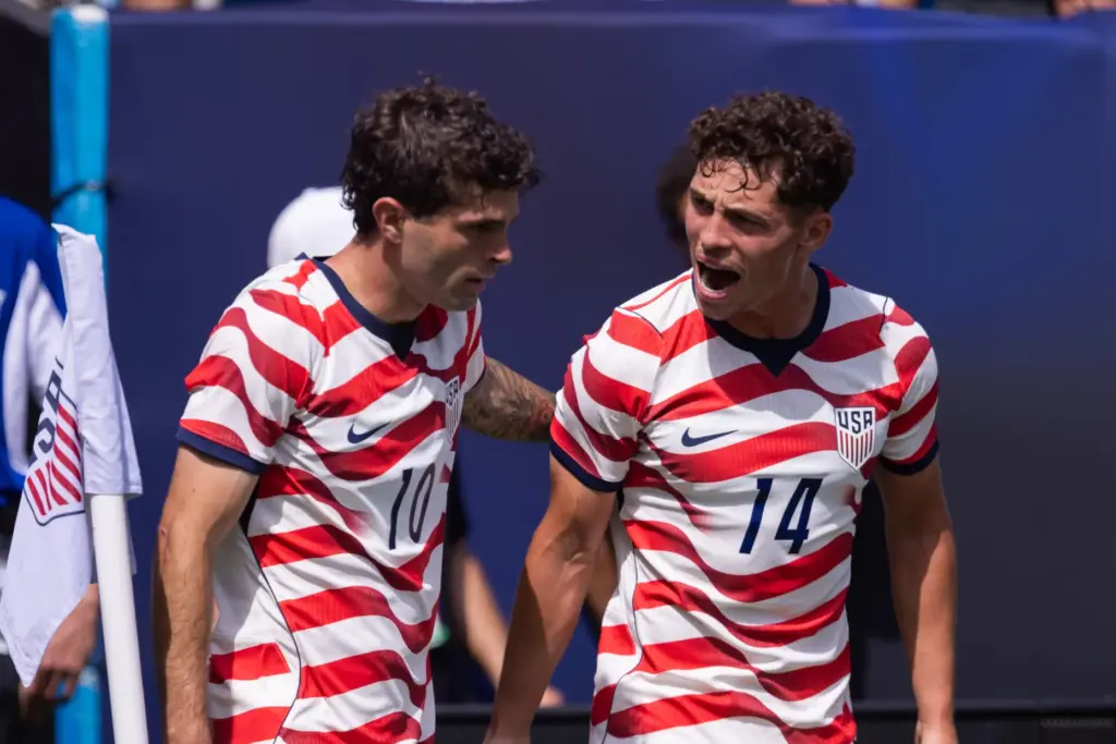 United States forward Christian Pulisic (10) celebrates with midfielder Sebastian...