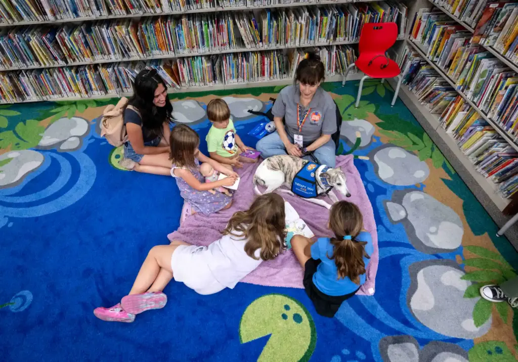 Kids read childrenâs books and give love to Alfie, a...