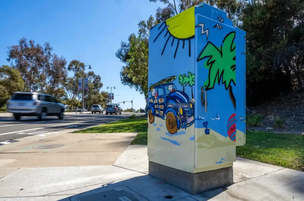 A painted utility box, entitled âBeach Party,â by local artist...