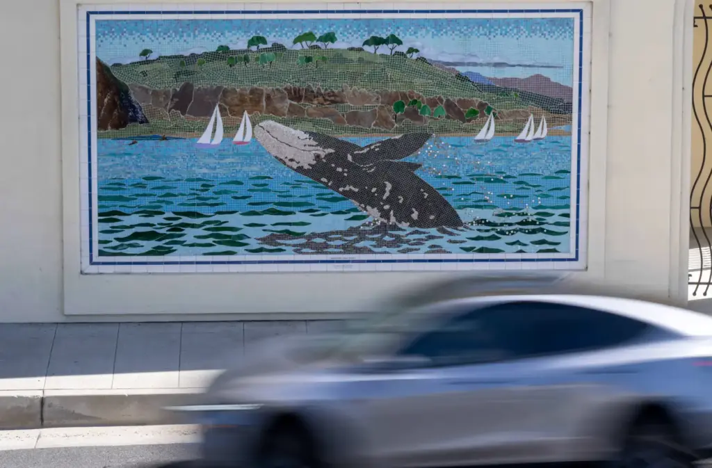 A mosaic by artist Lance Jost depicting a breaching humpback...