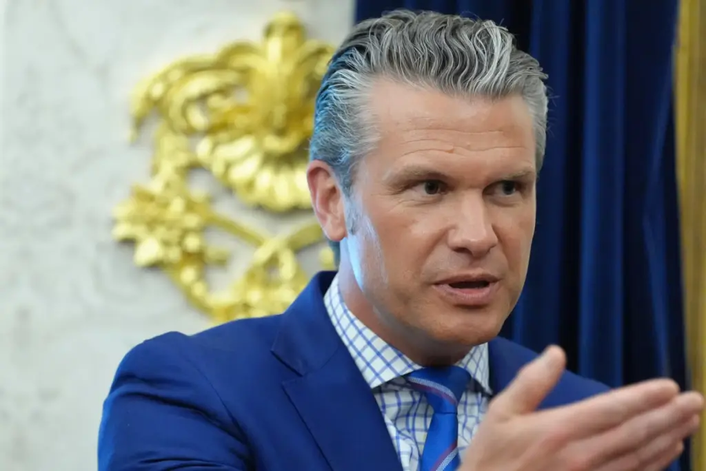 Defense Secretary Pete Hegseth speaks in the Oval Office of...