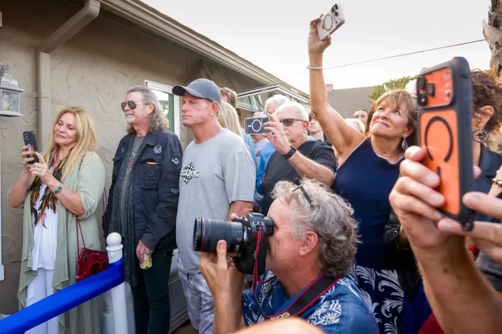 Laguna Beach residents jockey position to view the ribbon-cutting celebration...
