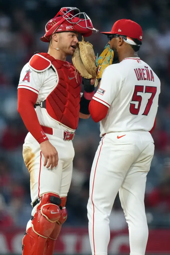 Angels catcher Logan O’Hoppe, left, and starting pitcher Walbert Urena...