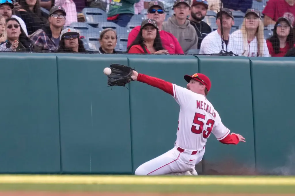 Angels left fielder Wade Meckler makes a sliding catch on...