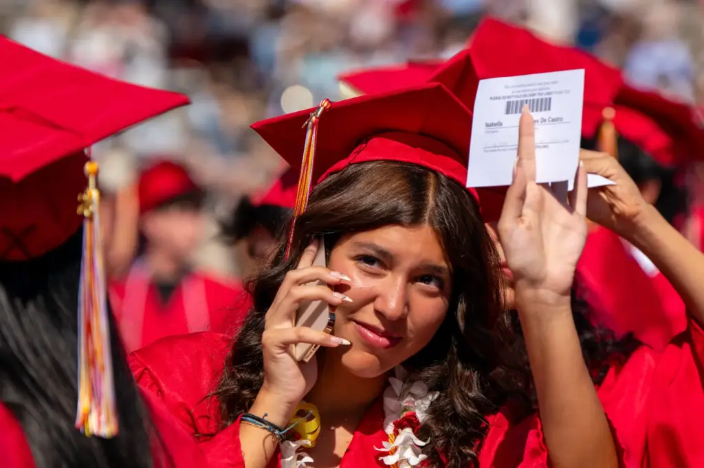 Woodbridge High School senior, Isabella Ayres De Castro waves to...