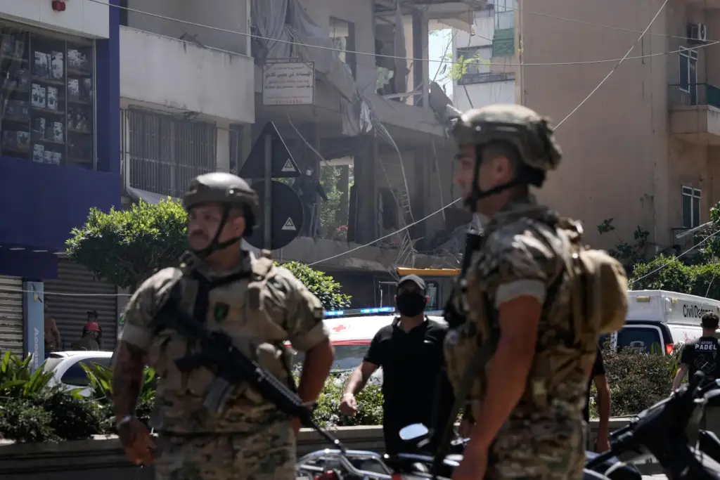 Lebanese soldiers stand guard at the site of an Israeli...