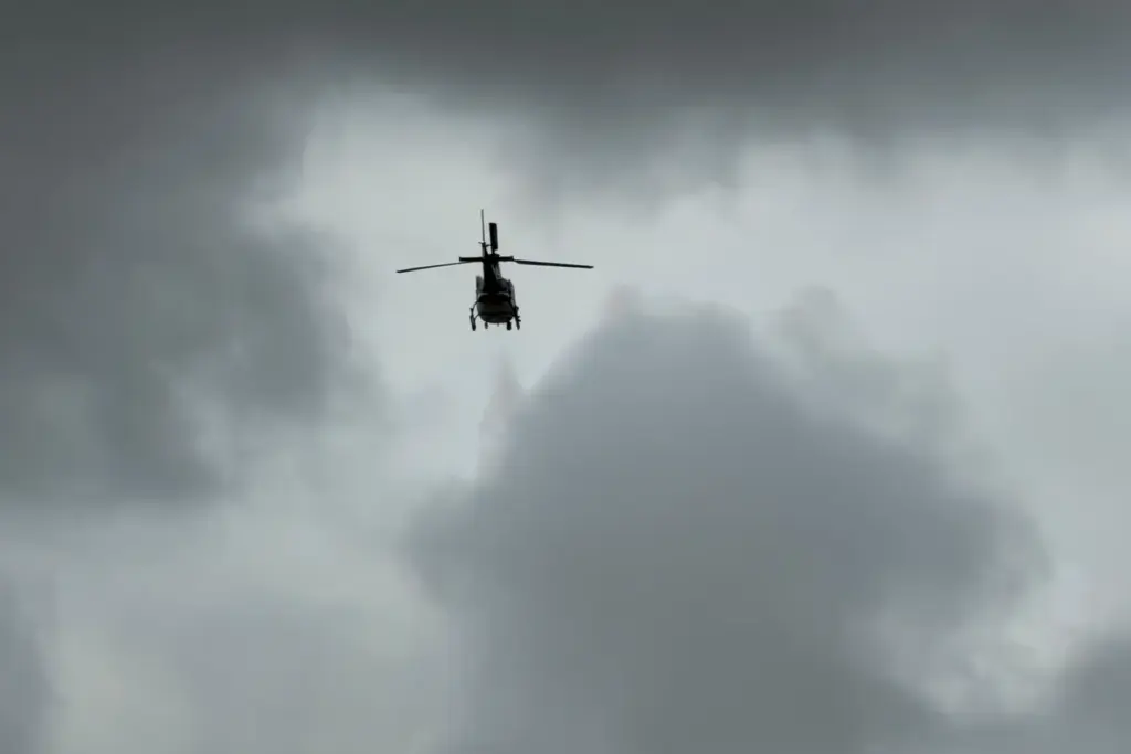 A helicopter flys over an active shooting scene Friday, June...