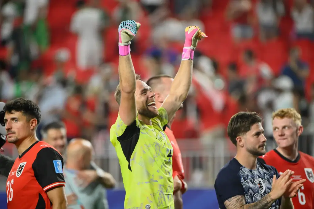 Austria goalkeeper Alexander Schlager (1) celebrates after the World Cup...