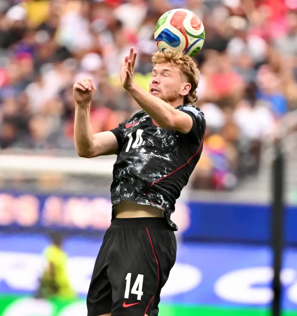 Canada midfielder Jacob Shaffelburg (14) with the header against South...