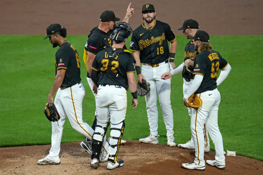 Pittsburgh Pirates relief pitcher Wilber Dotel, left, walks off the...