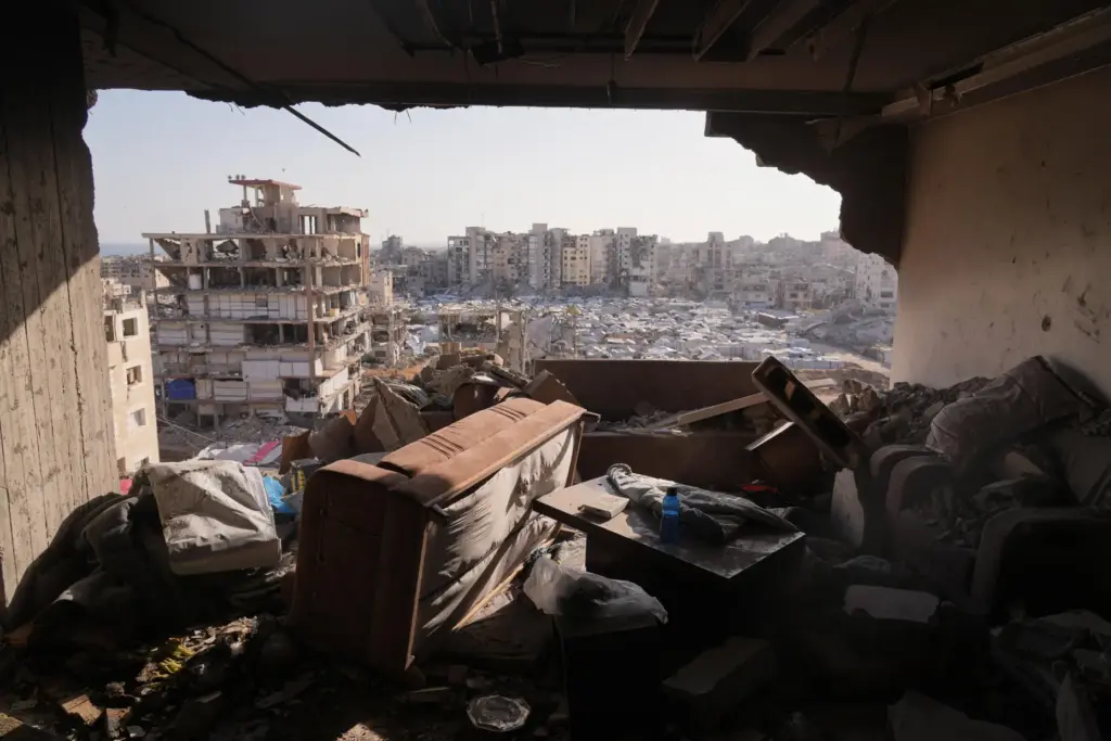 A damaged apartment in a residential building is seen after...