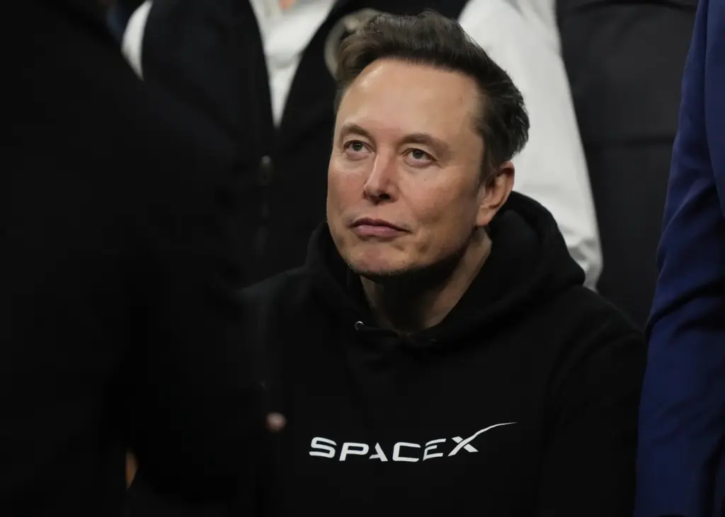 Elon Musk attends the finals for the NCAA wrestling championship.