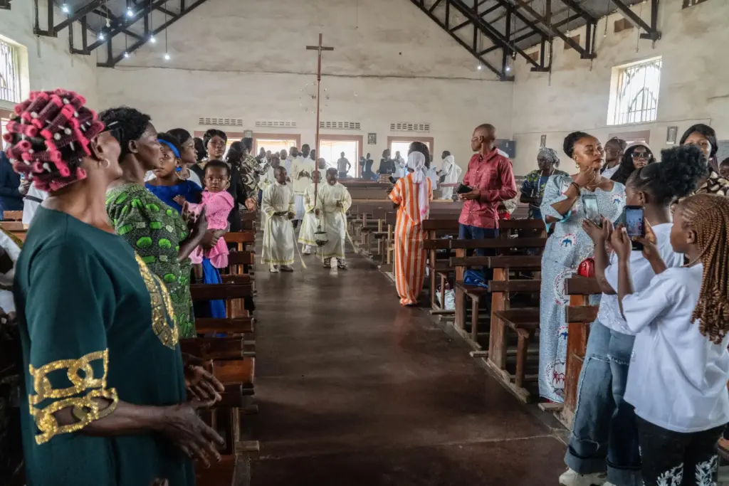 Altar boys arrive at a chapel during a wedding ceremony amid an Ebola outbreak.