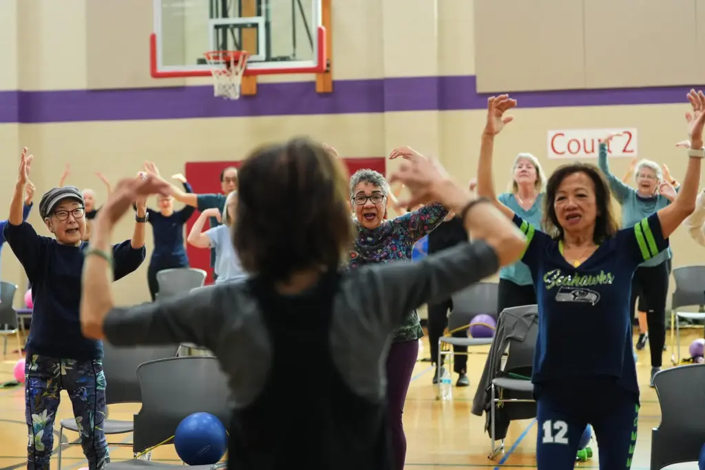 Ann Kashiwa, Alma Alvarez-Smith and Pilar Madayag follow instructor Bengie Santos.