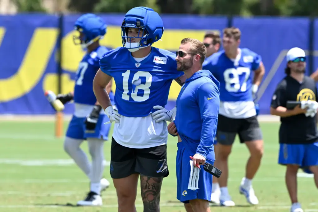 Rams head coach Sean McVay talks with tight end Terrance...