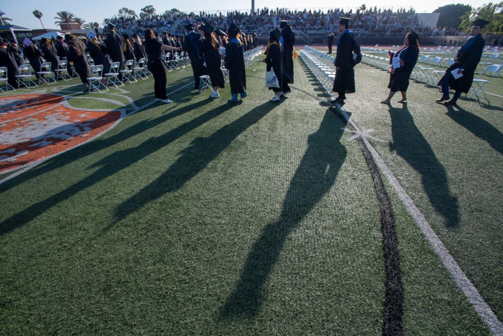 Graduates march into Fred Kelly Stadium at Santiago Canyon Collegeâs...