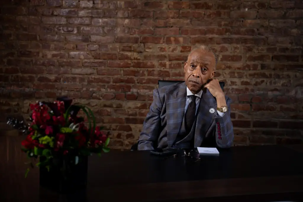 The Rev. Al Sharpton poses for a portrait at his desk.
