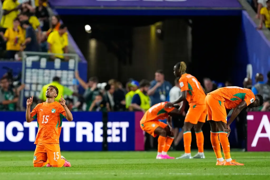 Ivory Coast’s Amad Diallo (15) reacts with teammates following their...